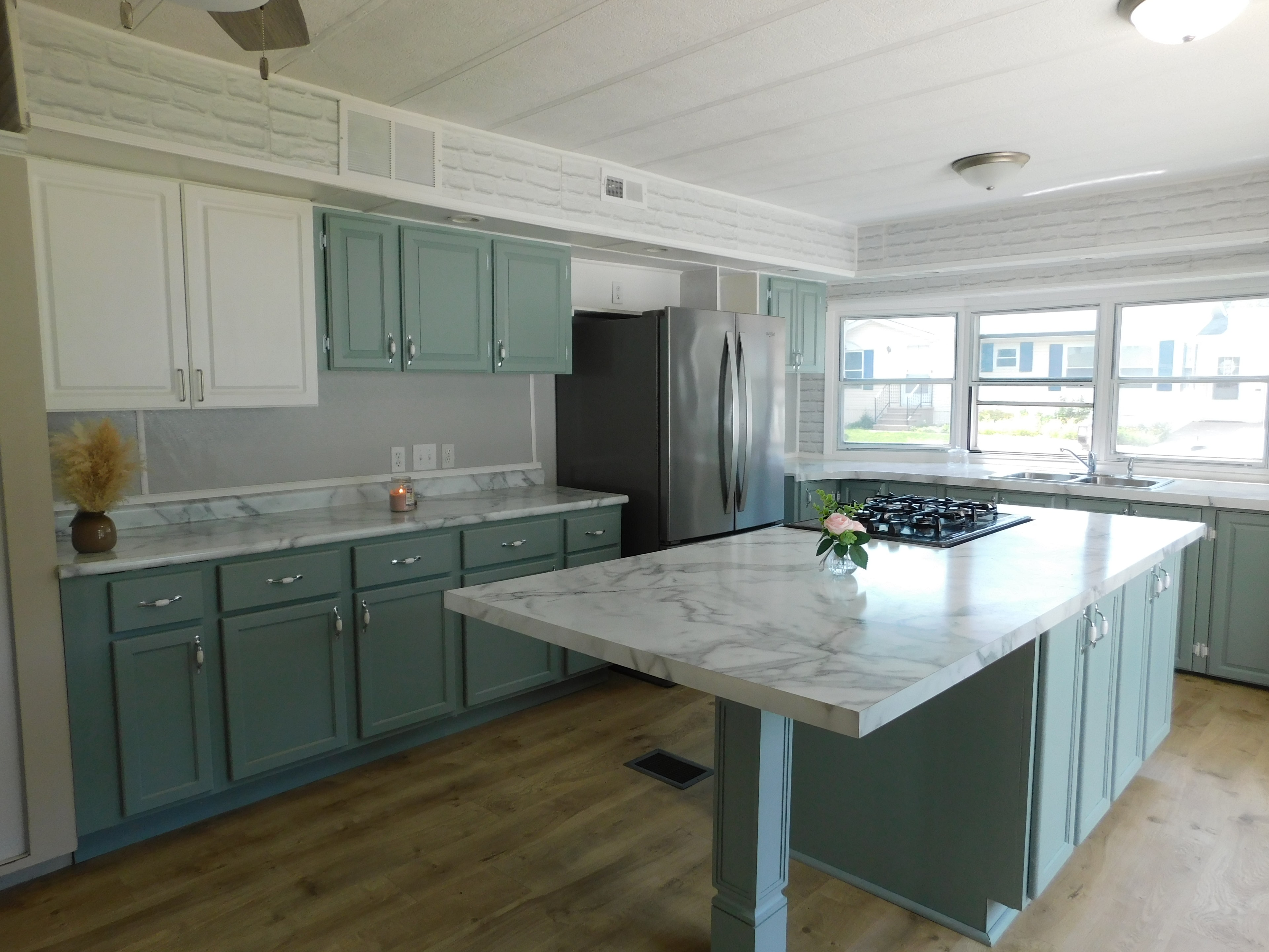 Kitchen — sage green cabinets & marble countertops