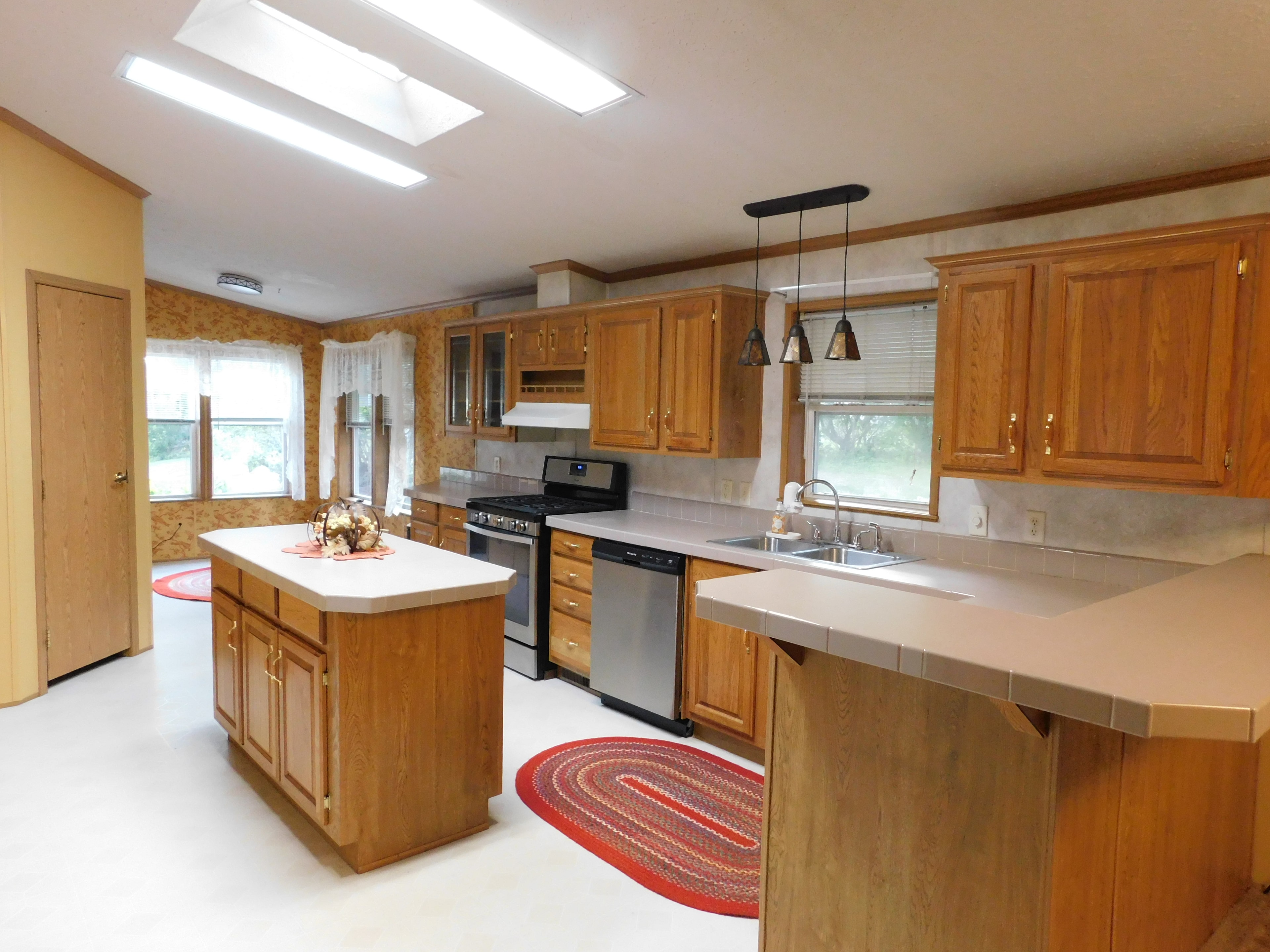 Kitchen with island and stainless appliances
